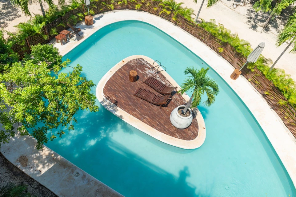 Aerial view of a pool with an island