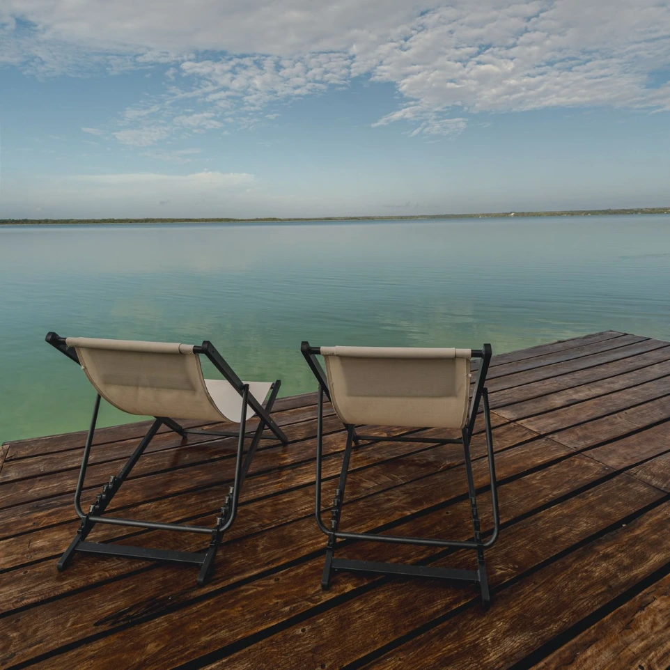Two chairs overlooking a relaxing lagoon